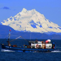 Monte Sarmiento with fishing boat seen from Bahia del Indio